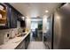 Bright kitchen featuring modern appliances, white countertops, and a view of the dining room at 5567 Executive Way, Norcross, GA 30071