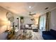 Cozy living room with plush seating, stylish decor, and sliding glass doors to sunroom at 5567 Executive Way, Norcross, GA 30071