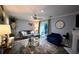 Comfortable living room with modern decor, fireplace, and access to a private outdoor space at 5567 Executive Way, Norcross, GA 30071