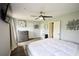 Main bedroom features a large bed, dresser, and ensuite bathroom access at 5567 Executive Way, Norcross, GA 30071
