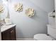 Stylish powder room with elegant floral decor, modern vanity and updated fixtures at 5567 Executive Way, Norcross, GA 30071