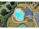 Aerial view highlighting a pool and clubhouse, offering an inviting space for community recreation and relaxation at 68 Hardy Water Dr, Lawrenceville, GA 30045