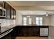 Kitchen featuring granite countertops, stainless steel appliances, and open layout to the living area at 68 Hardy Water Dr, Lawrenceville, GA 30045