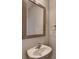 Close up on white vanity with mirror and towel ring in the powder room at 68 Hardy Water Dr, Lawrenceville, GA 30045
