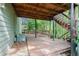 Spacious wooden deck with built-in seating and stairs leading to backyard. AC unit shown at 929 Hampton Nw Trl, Lilburn, GA 30047