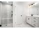 Bathroom with frameless shower, white cabinets and modern fixtures at 1704 Evenstad Way, Smyrna, GA 30080