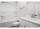 Bathroom features a white tub-shower and white vanity with a sink at 1704 Evenstad Way, Smyrna, GA 30080