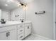 Bathroom with double vanity with modern fixtures and light at 1704 Evenstad Way, Smyrna, GA 30080