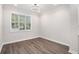 Well-lit dining room with hardwood floors, a large window, and contemporary lighting at 1704 Evenstad Way, Smyrna, GA 30080
