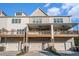 Back of building featuring garages and balconies, perfect for enjoying time outside at 1704 Evenstad Way, Smyrna, GA 30080