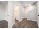 Hallway view of the entry to the downstairs bathroom and staircase at 1704 Evenstad Way, Smyrna, GA 30080