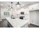Modern kitchen with white cabinetry, stainless steel appliances, and a large center island at 1704 Evenstad Way, Smyrna, GA 30080