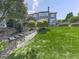 Spacious backyard with lush lawn, mature trees, and a multi-level deck perfect for outdoor entertaining at 310 River Birch Ct, Canton, GA 30114