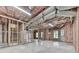 Unfinished basement space with exposed studs and insulation offers potential for customization at 310 River Birch Ct, Canton, GA 30114