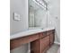 Bathroom vanity with modern fixtures, white countertop, wood cabinets, and tile flooring at 310 River Birch Ct, Canton, GA 30114