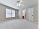 Bright bedroom with neutral walls, soft carpet and large window at 310 River Birch Ct, Canton, GA 30114