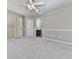 Carpeted bedroom featuring neutral paint, ceiling fan, with a doorway to the bath at 310 River Birch Ct, Canton, GA 30114
