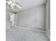 Bedroom with soft carpet, ceiling fan, and large window letting in ample light at 310 River Birch Ct, Canton, GA 30114
