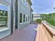 View of the wooden deck and the side of the house with lots of windows at 310 River Birch Ct, Canton, GA 30114