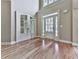 Grand foyer with soaring ceilings, hardwood floors, and elegant double doors at 310 River Birch Ct, Canton, GA 30114