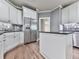 Well-lit kitchen with granite countertops, stainless steel appliances, and modern white cabinetry at 310 River Birch Ct, Canton, GA 30114