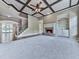 Open-concept living room with fireplace and stairs leading to the upper level, perfect for gatherings at 310 River Birch Ct, Canton, GA 30114