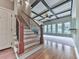 Elegant staircase with hardwood floors leading to an upper level and open floor plan at 310 River Birch Ct, Canton, GA 30114