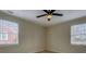 Cozy bedroom featuring hardwood floors and natural light through large windows at 4131 Carroll St, Covington, GA 30014
