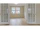 Bonus room with hardwood floors, natural light and double french doors at 4131 Carroll St, Covington, GA 30014