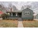 Charming exterior view of a cozy one-story home with a covered porch and well-maintained landscaping at 4131 Carroll St, Covington, GA 30014