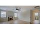Bright living room features a fireplace, two large windows, and an open doorway to the bathroom at 4131 Carroll St, Covington, GA 30014