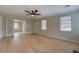 Inviting living room with hardwood floors, neutral walls, and glass doors leading to another room at 4131 Carroll St, Covington, GA 30014