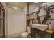 Bathroom featuring unique vessel sink, stylish mirror, decorative fixtures, and a shower with curtain at 5143 Floyd St, Covington, GA 30014
