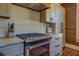 Stylish kitchen featuring granite countertops and stainless steel oven at 5143 Floyd St, Covington, GA 30014