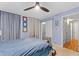 Tranquil bedroom featuring wood flooring, soft blue walls, a ceiling fan and comfortable furniture at 5400 Roswell Rd # Apt L6, Sandy Springs, GA 30342