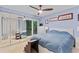 Bright bedroom featuring a sliding glass door and ample closet space with mirrored doors at 5400 Roswell Rd # Apt L6, Sandy Springs, GA 30342