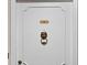 Detailed view of the unit door with a striking lion head knocker and unit number at 5400 Roswell Rd # Apt L6, Sandy Springs, GA 30342