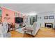 Cozy living room featuring hardwood floors, a fireplace, and natural light through sliding glass doors at 5400 Roswell Rd # Apt L6, Sandy Springs, GA 30342