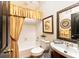 Well-maintained bathroom showcasing a tub, vanity, and decorative accents at 5936 Millstone Ln, Stone Mountain, GA 30087