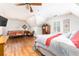 Spacious bedroom with wood floors, a seating area, and two bright windows at 5936 Millstone Ln, Stone Mountain, GA 30087