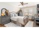 Cozy bedroom with a decorative iron bed and a comfortable seating area at 5936 Millstone Ln, Stone Mountain, GA 30087