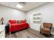 Cozy bedroom/sitting room featuring a white daybed and eye-catching leopard print chair at 5936 Millstone Ln, Stone Mountain, GA 30087