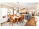 Inviting dining room with chandelier and hardwood floors, leading into kitchen area at 5936 Millstone Ln, Stone Mountain, GA 30087