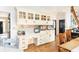 Bright kitchen workspace with cabinets, granite countertops, and hardwood floors at 5936 Millstone Ln, Stone Mountain, GA 30087