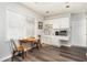 A charming kitchenette features white cabinets, a sink, and a microwave, complemented by a dining table at 5936 Millstone Ln, Stone Mountain, GA 30087