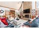 Spacious living room with stone fireplace, vaulted ceiling, and comfortable seating at 5936 Millstone Ln, Stone Mountain, GA 30087