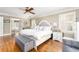 Bright main bedroom features a large bed, natural light, and an ensuite bathroom at 5936 Millstone Ln, Stone Mountain, GA 30087