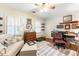 Comfortable office space with lots of light, a couch, and neutral colors at 5936 Millstone Ln, Stone Mountain, GA 30087