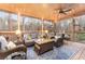 Inviting screened porch with comfortable seating and scenic views, perfect for relaxation at 5936 Millstone Ln, Stone Mountain, GA 30087