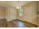 Dining area featuring wood-look floors, neutral walls, and a chandelier lighting fixture at 170 Hidden Pines Dr, Covington, GA 30016